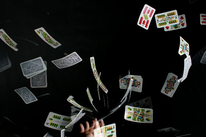 playing cards on black textile